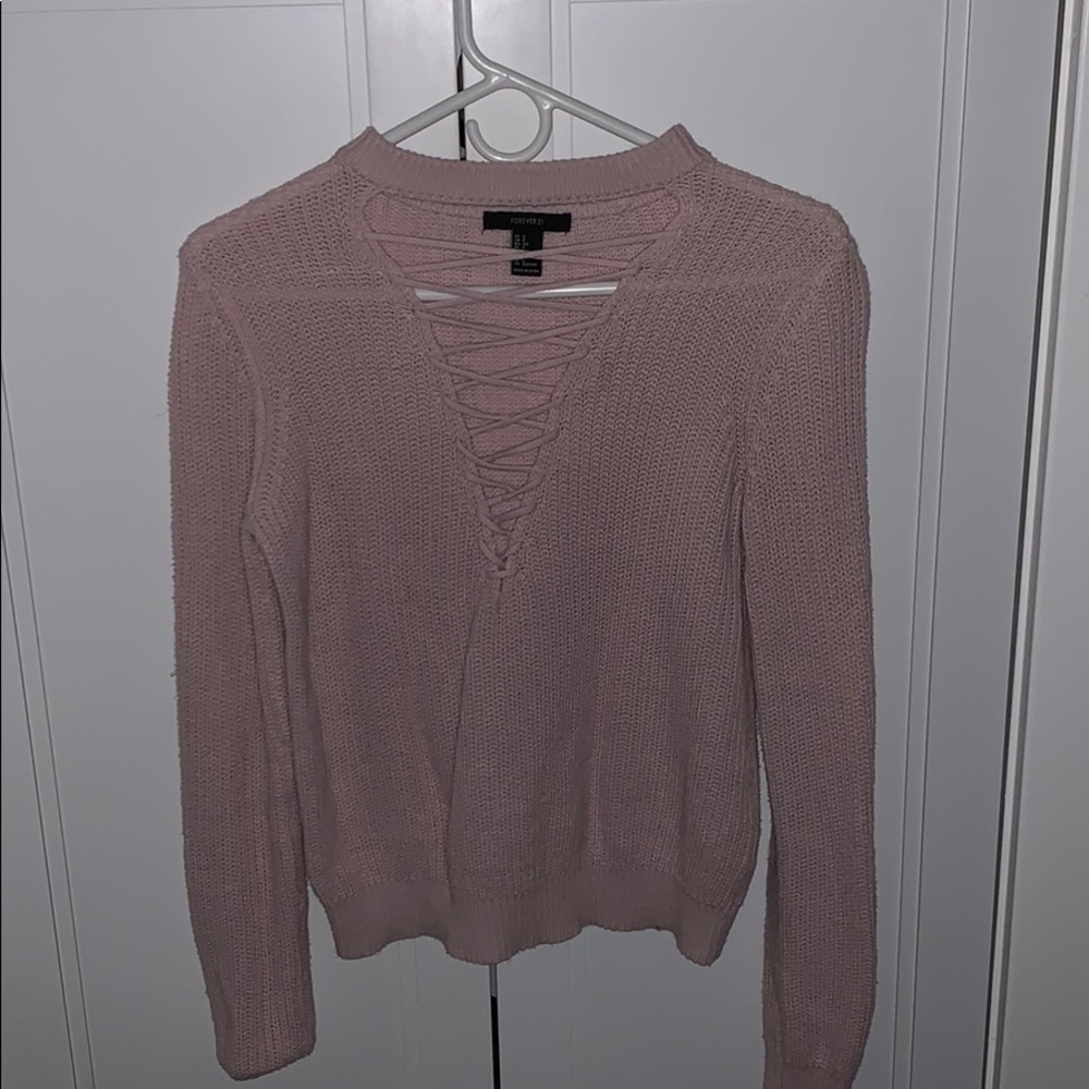 pink sweater with crossed v neck